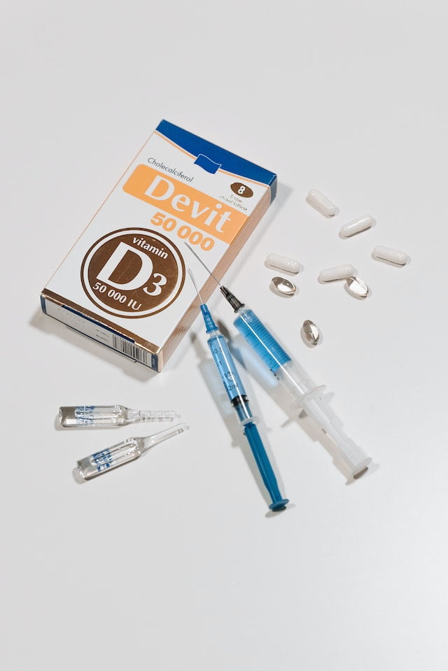 A package of d-syringes and syringes, providing essential tools for administering medical treatments, neatly arranged on a pristine white surface.