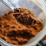 A spoonful of brown powder packed with a powerful blend of longevity and wellness tips, specifically designed to provide anti-aging benefits.