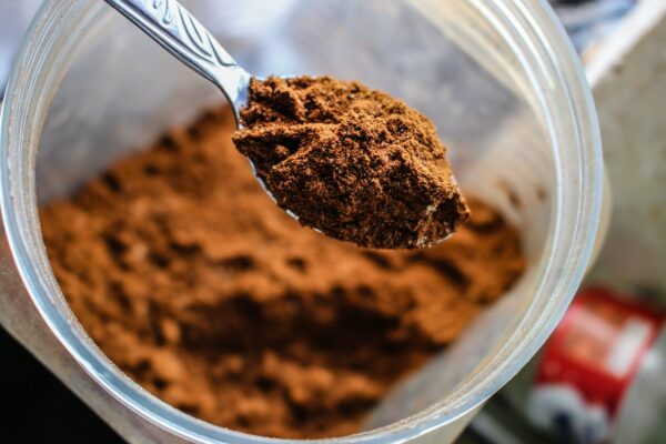 A spoonful of brown powder packed with a powerful blend of longevity and wellness tips, specifically designed to provide anti-aging benefits.