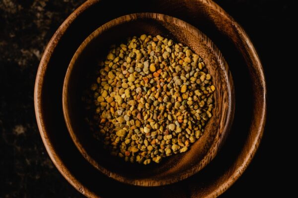 A Top View of Bee Pollen in a Wooden Bowl