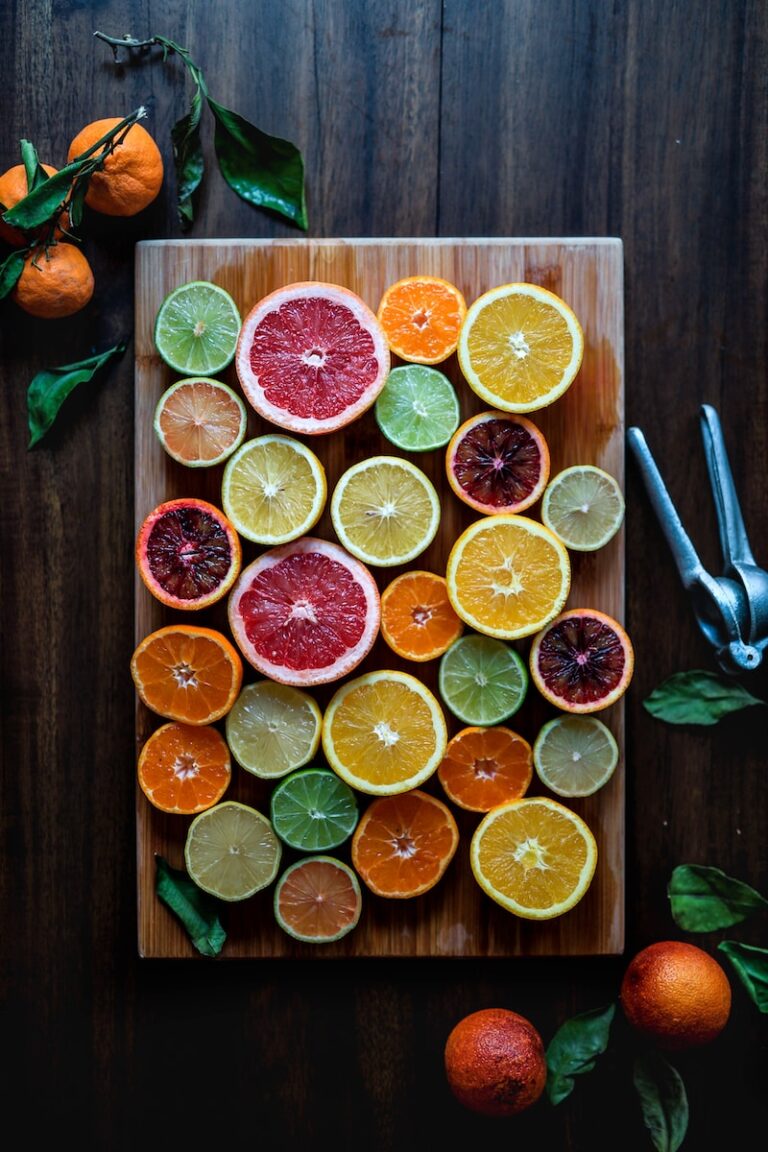 Anti-aging wellness tips featuring citrus slices on a wooden cutting board.