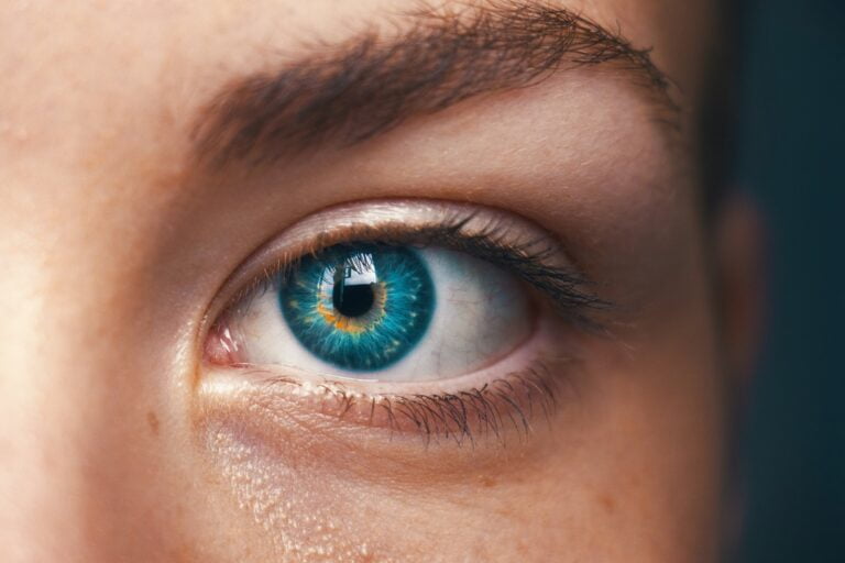 A close up of a woman's eye with blue eyes, showcasing senior health and wellness tips for anti-aging.